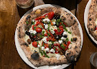 A wood-fired pizza from Il Caminetto
